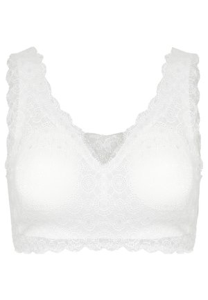 Balti nėriniai bralette'as su banguotu kraštu, turintis V formos iškirptę ir tekstūruotą modelį. Minkštos, be paminkštinimo, taurės komfortui ir palaikymui.