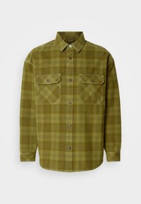 Chemise à carreaux verts en coton, dotée d'un col à bouton, de deux poches avant avec rabats et de manches longues avec des poignets à bouton.