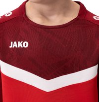 Rode sportshirt met ronde hals, textuurdesign, witte streep over de borst en 'JAKO'-logo in het wit op de voorkant.
