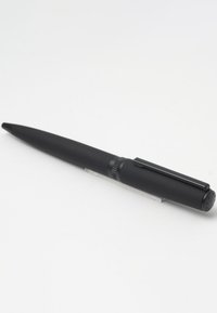 Black ballpoint pen with a smooth matte texture, a rounded tip, and a clip on the side. Features a visible twist mechanism for retracting.