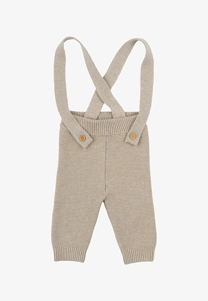 Beežid kootud üleüldised riided, millel on ristuvad rihmad, kaks puidust nööpi ees, kitsenevad jalad ja tekstuuriga muster kogu ulatuses.