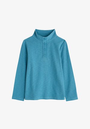Pólder azul de manga larga con un cuello alto y cuatro botones en el centro delantero.