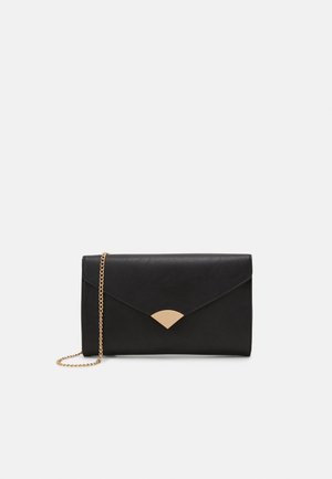 Black leather envelope clutch with gold triangular clasp and thin gold chain strap on plain light background.