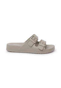 Lys beige skridsandale lavet af tekstureret materiale, med to justerbare spænder og en flad, rillet sål for godt greb.