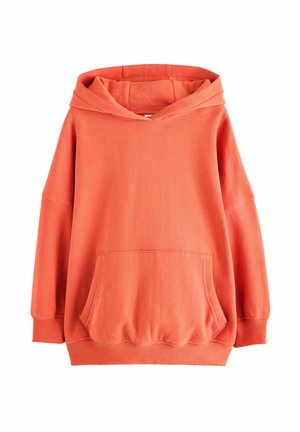 Bluza z kapturem w jasnym koralowym kolorze, z przestronną kieszenią z przodu, w oversize'owym fasonie oraz ściągaczami przy mankietach. Posiada dużą, regulowaną kieszeń.