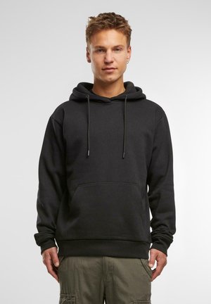 Schwarzer Kapuzenpullover mit Kordelzügen, Fronttasche und gerippten Bündchen. Hergestellt aus weichem Stoff, mit entspannter Passform und minimalistischem Design.