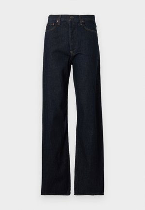 Tmavomodré riflové nohavice s vysokým pásom, rovný strih nohavíc, štýl s piatimi vreckami a kontrastným prešívaním na švoch.