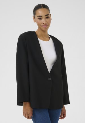 Black blazer with a deep v-neck, single button closure, and loose fit. Made of smooth fabric, features long sleeves and no visible pockets.