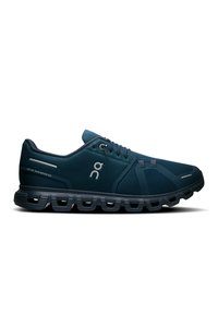 Chaussure de course bleue avec tige en mesh, bout arrondi, système de laçage et semelle rembourrée dotée d'insertions circulaires évidées pour plus de flexibilité.