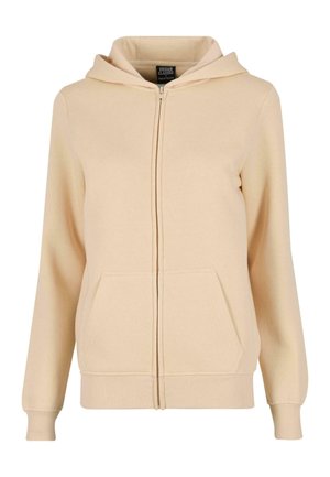 Beżowa bluza z kapturem na zamek, wykonana z miękkiego materiału, z przednią kieszenią, ściągaczami na rękawach oraz kapturem ze sznurkiem. Prosty design bez wzorów.