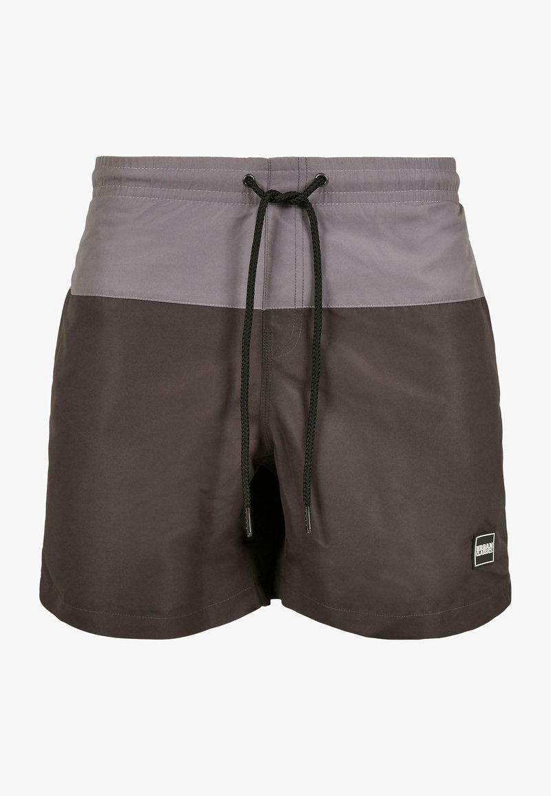 Shorts de bain courts en nuances de gris, avec une taille à cordon et une texture lisse. Un petit logo noir est visible sur le côté.