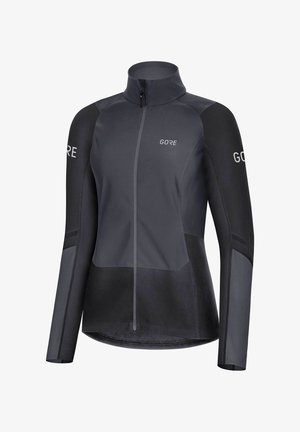 Veste de cyclisme noire et gris foncé à manches longues avec fermeture éclair frontale et le nom de la marque Gore imprimé sur la poitrine et les manches.