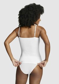 White fitted tank top with thin straps, smooth texture, and a straight hem, paired with matching briefs, viewed from the back.