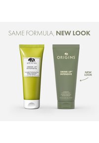Deux tubes du masque hydratant intense de nuit Drink Up d'Origins ; à gauche, vert olive, à droite, vert doux. Les deux font 75 ml, avec des détails sur l'étiquette.