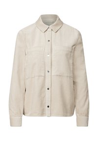 Veste chemise en velours côtelé beige avec des rayures verticales, fermeture à boutons sur le devant, deux poches poitrine et un col. Manches longues avec poignets à boutons.