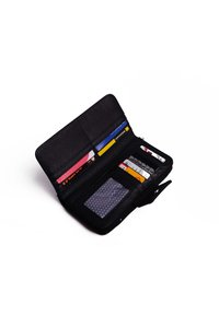 Black zip-around wallet with multiple card slots, a transparent ID pocket, and a textured surface. Interior features a polka-dot design.