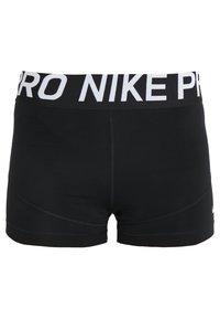 Czarne spodenki sportowe z szerokim białym pasem z nadrukiem "PRO NIKE PRO". Gładki, elastyczny materiał z wyprofilowanymi szwami.