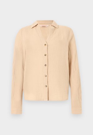 Helebeež pikkade varrukatega nööbitav särk peene tekstuuriga kangast ja klassikalise kraega.