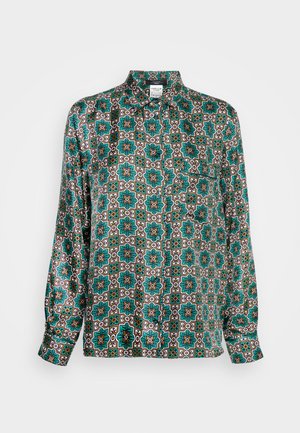Chemise en soie imprimée avec un motif géométrique en bleu sarcelle, marron et blanc. Manches longues avec poignets à boutons et col.