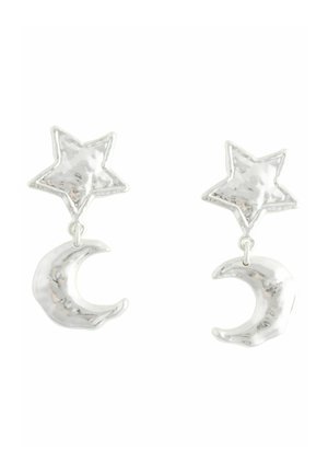 Silver earrings featuring a star-shaped stud with a polished finish, connected to a crescent moon drop design, both with smooth texture.