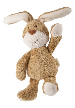 Lapin en peluche marron avec une tache blanche sur le nez et des coussinets, debout avec un bras levé et une jambe levée.