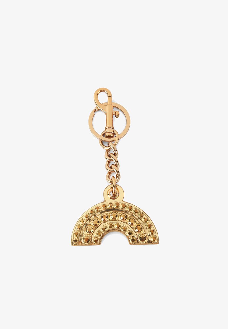 Goudkleurige sleutelhanger in de vorm van een regenboog, versierd met ronde studs, en bevestigd aan een ronde sluiting met een ketting.