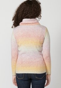 Knit sweater with a cowl neck, featuring a gradient pattern in pastel pink, yellow, and blue, with ribbed cuffs and hem.