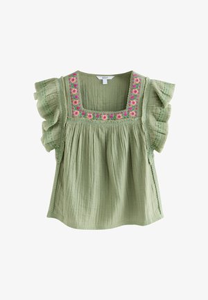 Világoszöld blúz, amely texturált anyagból készült, négyzet alakú nyakkivágással, fodros ujjakkal és rózsaszínű, lila virágmintákkal hímzett.