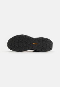 Rett svart gummisåle med dype spor for grep, med et karakteristisk Continental-logo i oransje og teksturerte overflatedetaljer.