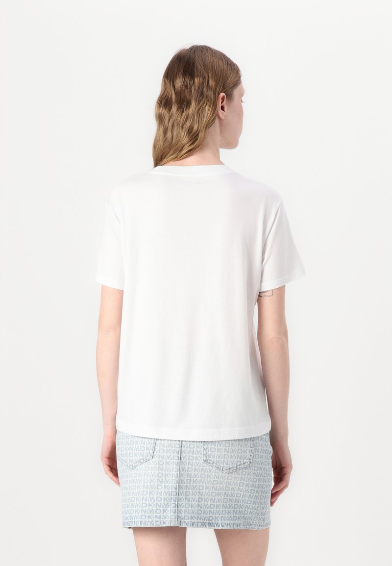 T-shirt Blanc DKNY NYC – Taille L – Logo Pont De New York – Strass – Femme
