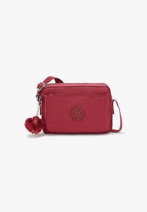 Borsa a tracolla rossa in nylon con finitura testurizzata, dotata di una tasca frontale con zip, una tracolla regolabile e un portachiavi a forma di scimmietta pelosa.