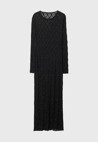 Robe longue noire en dentelle avec manches longues et encolure ronde, présentée à plat sur un fond neutre.