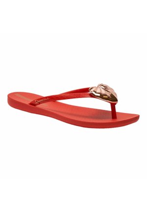 Infradito in gomma rossa con una superficie interna testurizzata, fascia sottile e un luccicante embellishment a forma di cuore dorato sulla parte centrale.