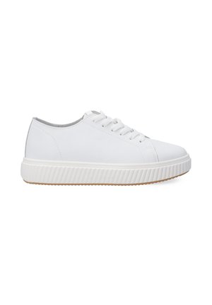 White leather sneakers with a rounded toe, lace-up design, and textured, ribbed rubber sole. Features a smooth upper and gray accents.