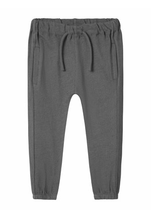 Graue Sweatpants aus weichem Stoff, mit einem elastischen Bund und Kordeln, zwei seitlichen Taschen und elastischen Bündchen an den Knöcheln.