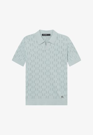 Lichtblauw poloshirt met korte mouwen, voorzien van een subtiel reliëfpatroon en een klein zwart logo op de onderkant van de rechterzoom.