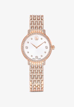 Roségouden polshorloge met een ronde kast, een witte wijzerplaat, kristalaccenten en een armband met meerdere rijen kristallen. Zwitsers vervaardigd met lichtgevende wijzers en uurmarkeringen.