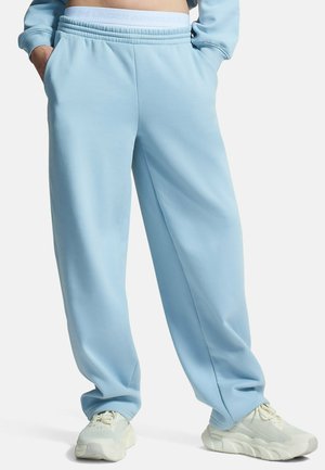 Under Armour, ICON FLEECE RELAXED - Tracksuit bottoms - blue fog