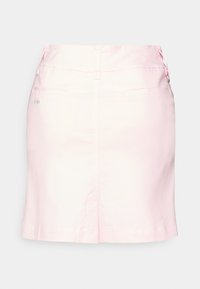 Ljusrosa kjol i bomullsblandning med dragkedja fram, två sidofickor och knappdetaljer vid midjan. Mjuk textur.