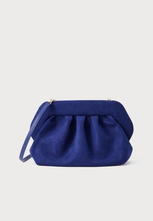 Blue suede clutch bag with gathered texture, a structured shape, and a thin strap. Features a gold zipper closure and smooth finish.