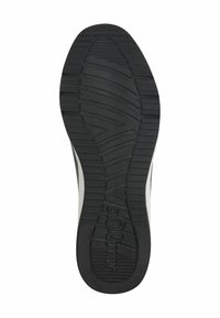 Suola in gomma nera con pattern testurizzati e linee di grip. Presenta una punta arrotondata e un accento laterale bianco. Taglia contrassegnata come 37.