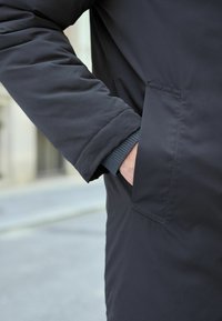 Next SHOWER RESISTANT WADDED LONG - REGULAR FIT - Jachetă parka - navy blue