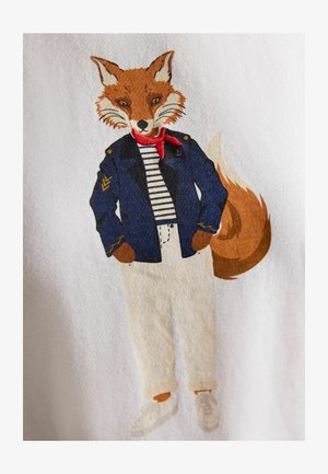 Anthropomorphic fox wearing navy jacket, striped shirt, white pants, red scarf, and white shoes, standing with hands in pockets.