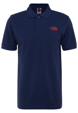 Granatowa koszulka polo z krótkim rękawem, dwoma guzikami i pomarańczowym logo "The North Face" na lewej piersi.