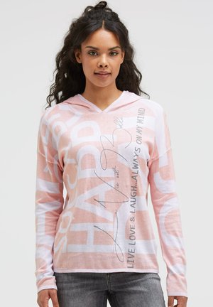 Kapuzensweatshirt in Hellrosa und Weiß mit großen Textgrafiken und lockerer Passform. Hergestellt aus weichem, leichtem Material.