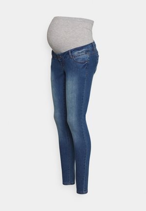 Calças de maternidade com um painel abdominal cinzento e elástico em denim azul. O design ajustado apresenta um efeito desbotado e o típico estilo de cinco bolsos.