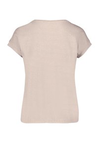 Beige Kurzarmoberteil mit lockerer Passform. Weicher Stoff, runder Halsausschnitt und einfache Verarbeitung. Keine sichtbaren Muster oder Verzierungen.