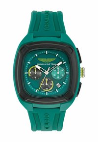 Zaļš gumijas rokas pulksteņi ar taisnstūra korpusu, vairākiem zemapvalkiem, baltiem rādītājiem, melniem akcentiem un datuma displeju sešos.