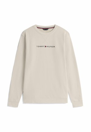 Beiger Pullover mit langen Ärmeln, gerippten Bündchen und Saum, mit schwarzem Logotext "TOMMY HILFIGER" und einem kleinen rot-weißen Emblem.