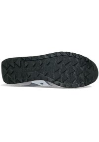 Zwarte rubberen schoenonderzijde met opvallende driehoekige noppen, grijze accenten en een gestructureerd oppervlak. Merkenlogo zichtbaar nabij het midden.